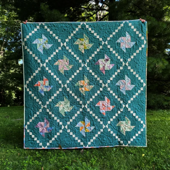 Green pinwheels baby quilt pattern